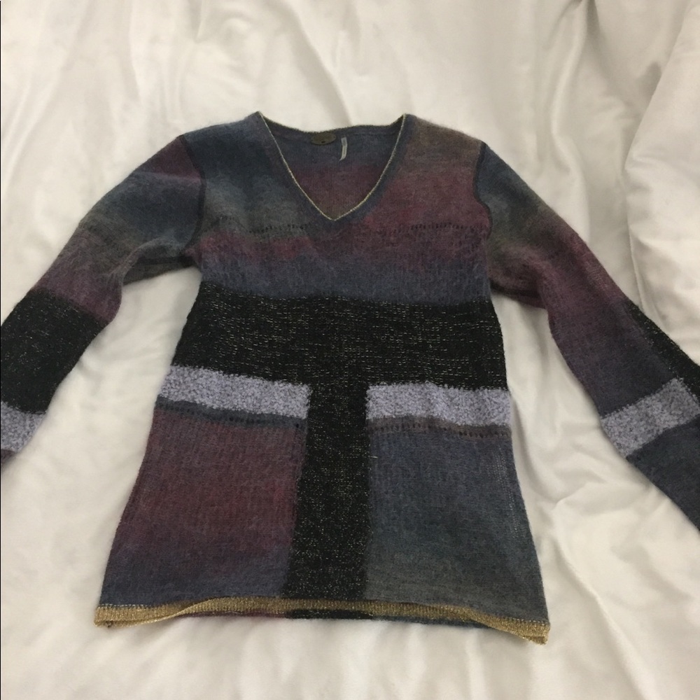 One girl who... multicolored sweater